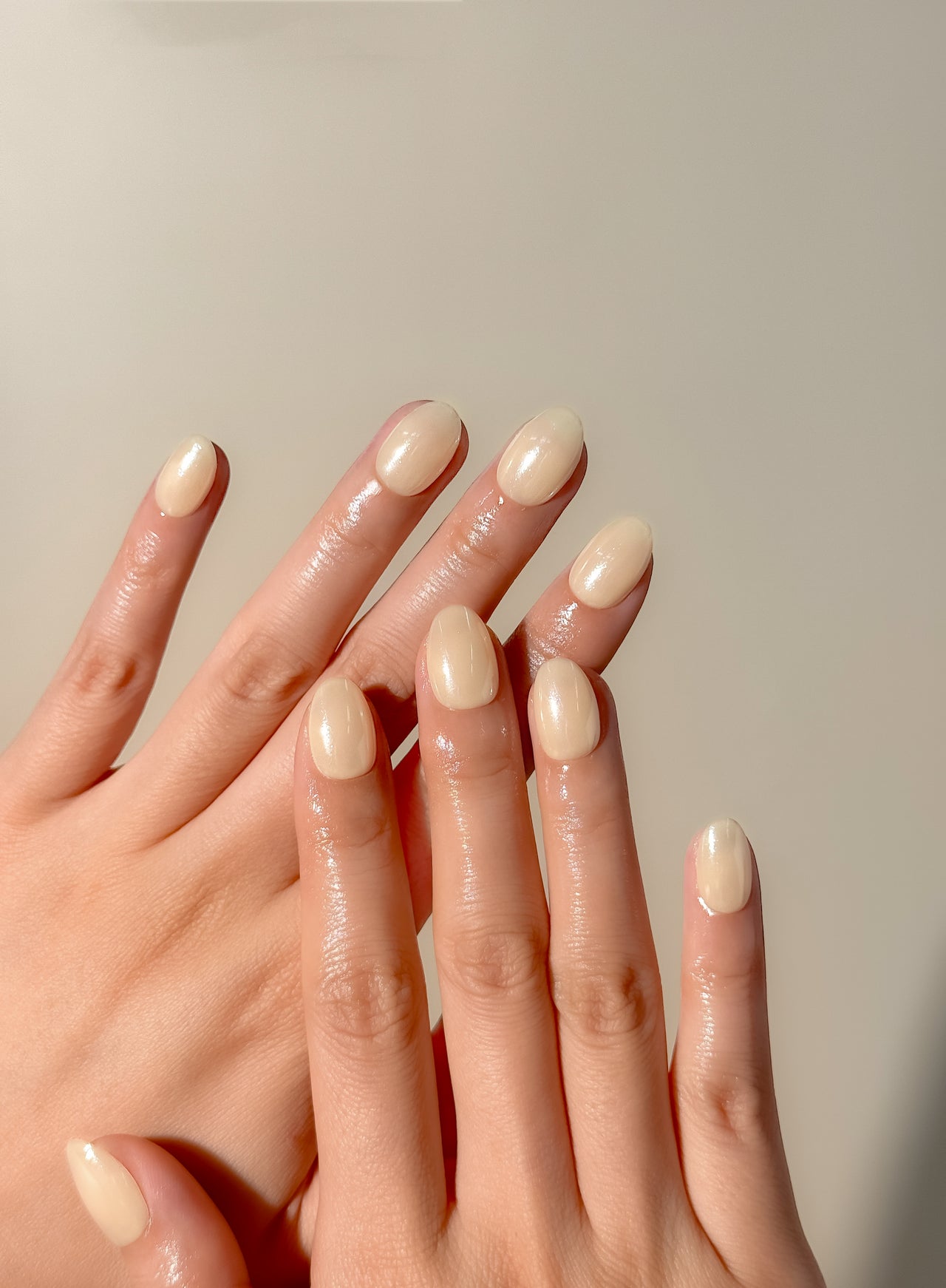 Butter yellow glazed press-on nails in an extra short oval shape with a glossy creamy finish. Handmade reusable false nails inspired by butter yellow nails, soft pastel manicures and clean girl summer nail trends.