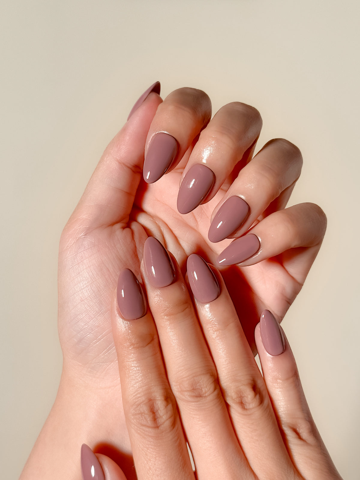 Velvet Blush reusable mauve-taupe short almond press-on nails worn on both hands with a smooth high-gloss finish.