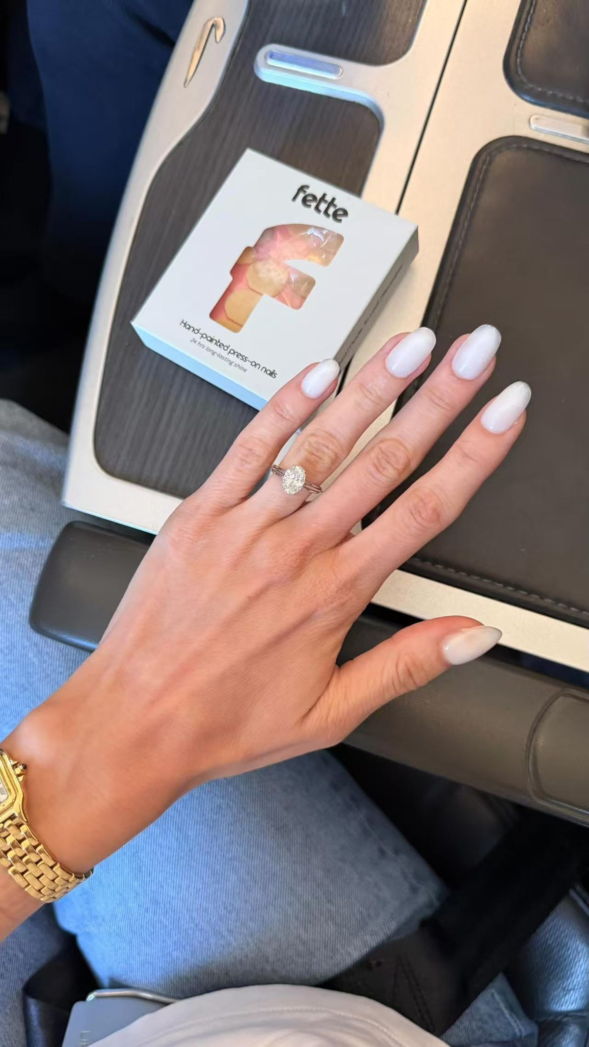 Close-up of Heavy Cream milky white Short Oval press-on nails with a smooth, seamless high-shine finish.